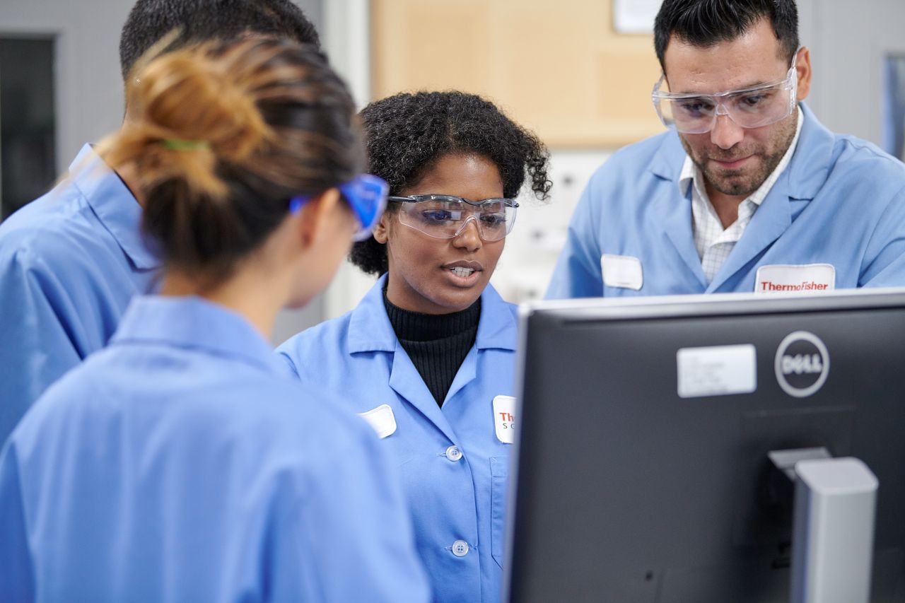 Scientists collaborating in a laboratory